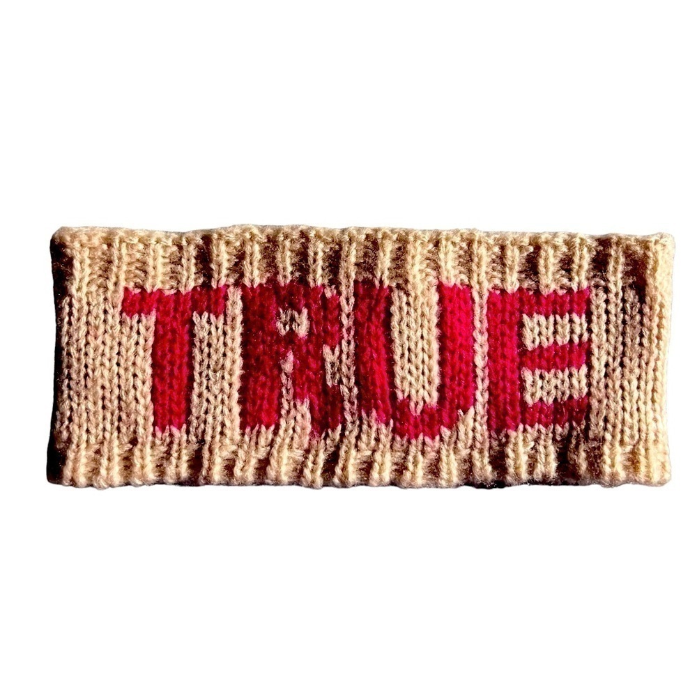 BCBGENERATION Tan Acrylic Headband with TRUE across front.